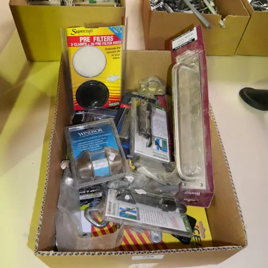box of door hardware and window latches etc