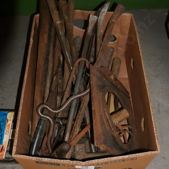 box of rusty allsorts; tyre irons, sickles, bale hooks, weights etc