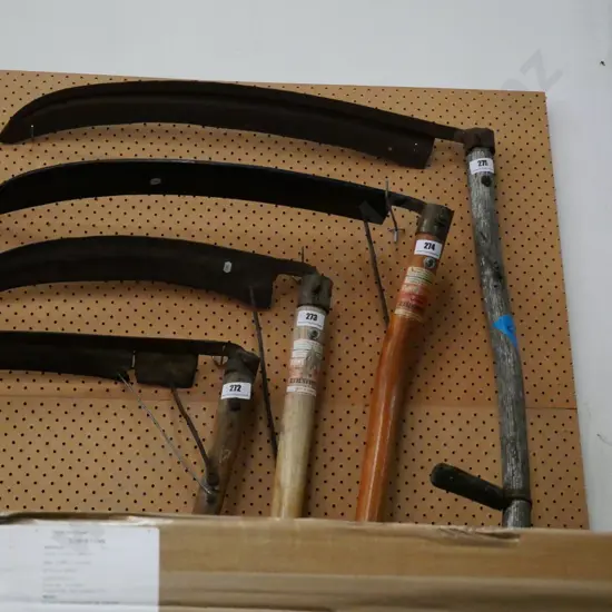 scythe with weathered handle