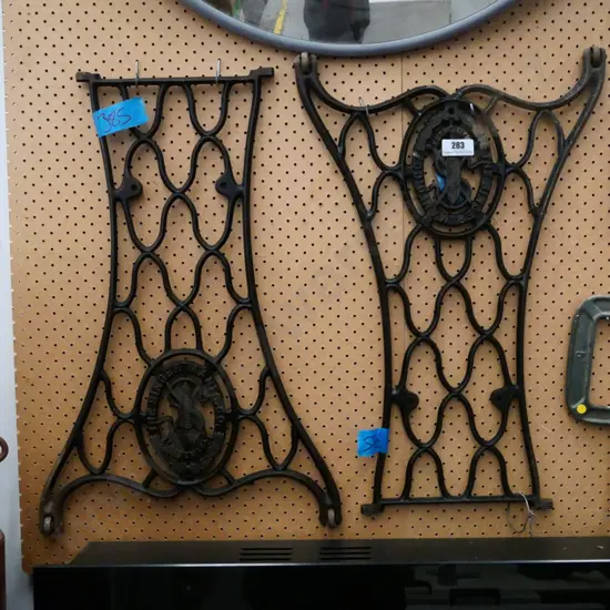 2 cast iron sections from treadle sewing machine base