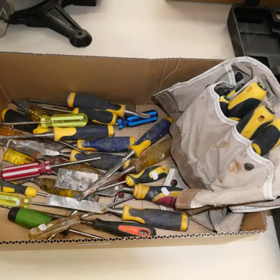 box; various screwdrivers and chisels