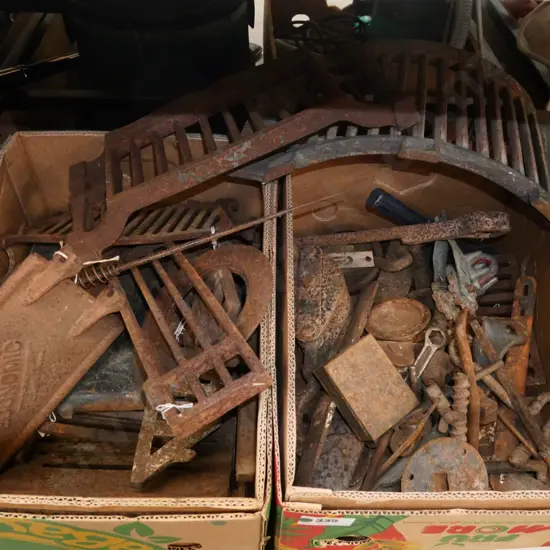 2 boxes of rusty allsorts; pulleys, fire graters, wire strainers etc