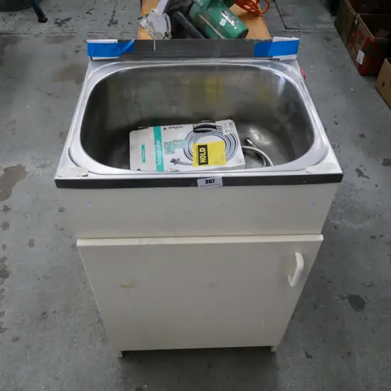 laundry sink with plumbing fittings