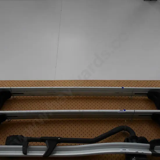 pair of Thule roof racks - blue dots