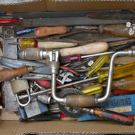 box; screw drivers, crescents, sharpening stones etc