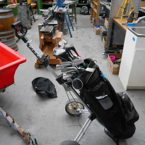 golf clubs and trundler