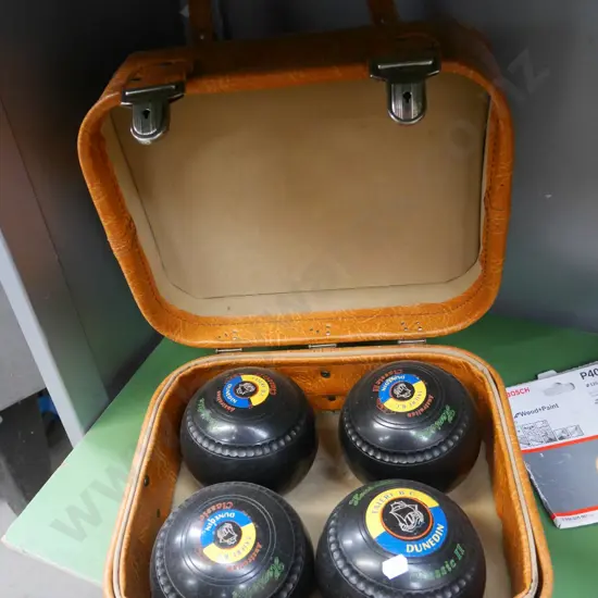 4 cased Henselite lawn bowls