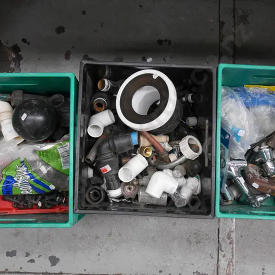 3 plastic tubs of irrigation and plumbing fittings
