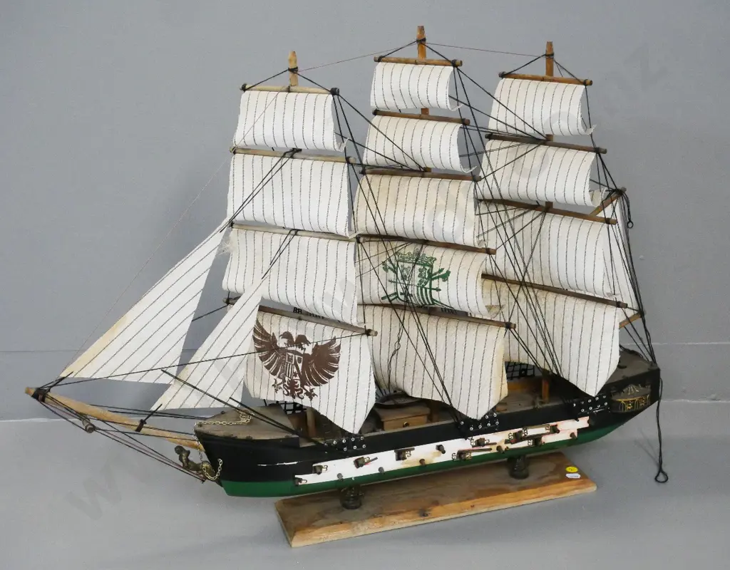 wooden model sailing ship on stand - unknown insignia on sails. H570 L750 Image 1++