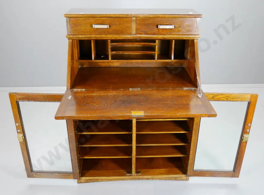 deco oak drop-front writing desk w/2 upper drawers, glazed cupboard, interior shelves & dividers H1170 W840 D440 Image 1++