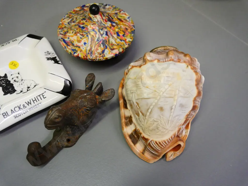 retro multi colour plastic trinket, Black & White whisky ashtray, carved shell w/brass fitting, cast brass coat hook etc Image 1++