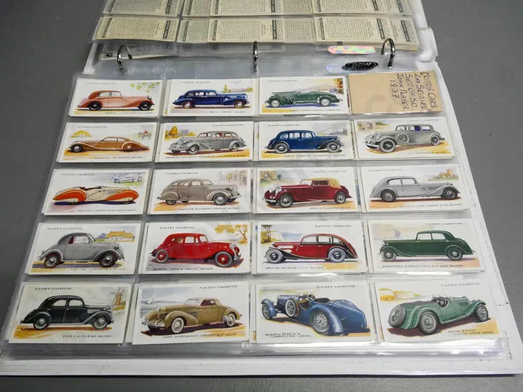 binder full of cigarette collector's cards in album sheets - cars, trains, ships, etc. Image 1++