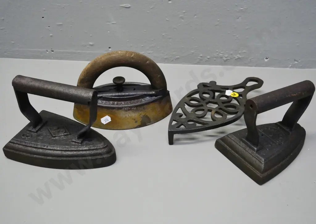 3 sad irons and a trivet - wooden handled iron has Enterprise MFG Co. Philadelphia PA Image 1++