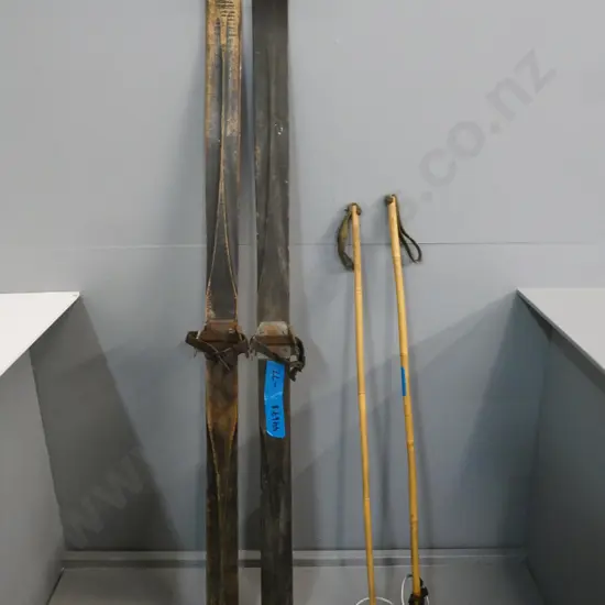 pair of vintage wooden skis L-1510 and poles with leather basket straps - corrosion to ski bindings