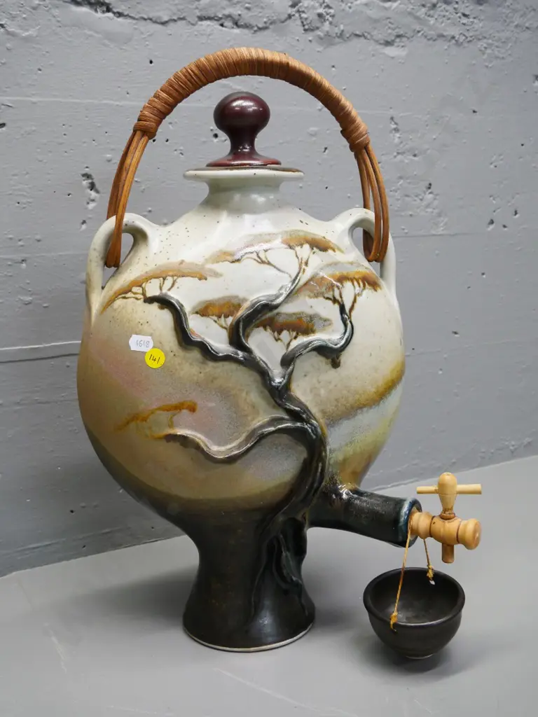 Christopher Clouston Nelson studio pottery drinks dispenser with cane handle, hanging drip cup, wooden spigot H470 W260 Image 1++