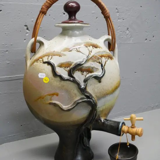 Christopher Clouston Nelson studio pottery drinks dispenser with cane handle, hanging drip cup, wooden spigot H470 W260