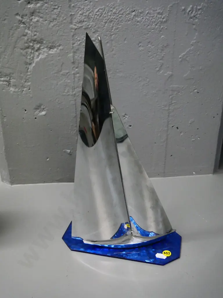 deco chrome yacht on blue rippled glass base H-350 Base W-220 D-100 Image 1++