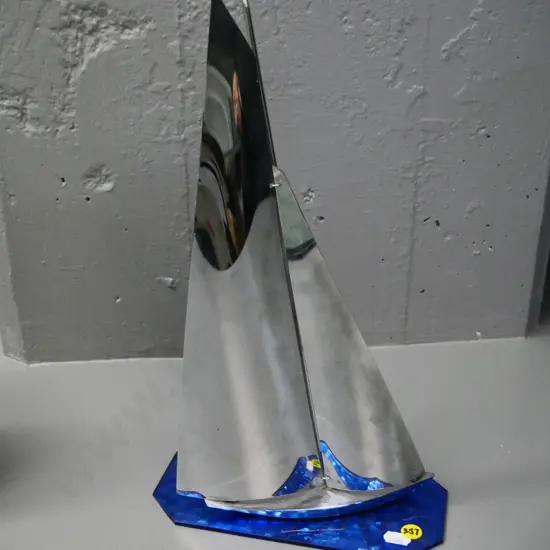 deco chrome yacht on blue rippled glass base H-350 Base W-220 D-100