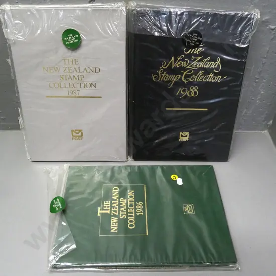 3 slip-cased hard bound New Zealand Stamp Collection issues 1986, 1987, 1988