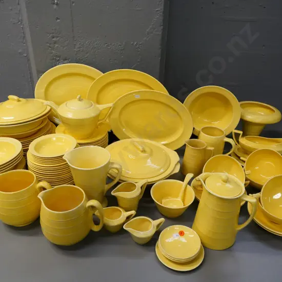 large quantity of Crown Ducal yellow dinnerware including teapot, jugs, etc.