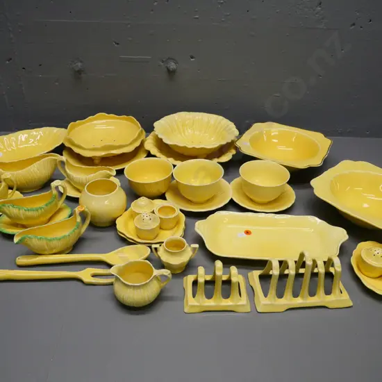 large quantity of Crown Ducal yellow table and serving ware - one server mended, some finish wear