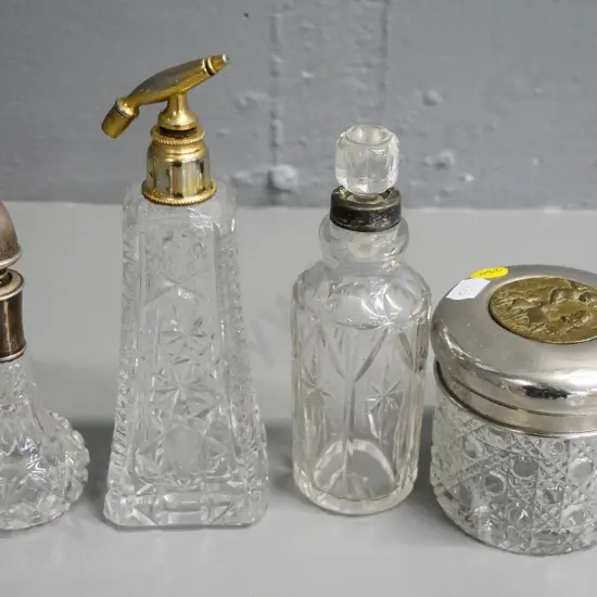 3 vintage crystal / depression glass scent bottles, one sterling silver mounted, one covered pot, atomiser part missing