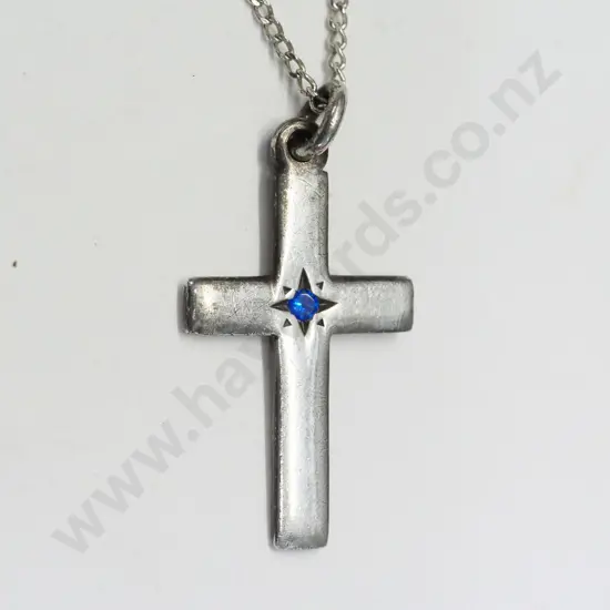 silver crucifix with small blue stone stamped 925