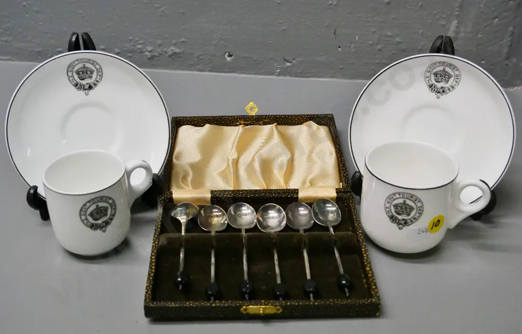 cased set of plated coffee bean spoons and 2 Tuscan demi-tasse cups & saucers with NZ Gov. Tourist Dept. logos Image 1++