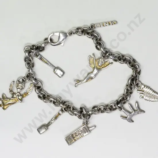 silver charm bracelet with 8 charms some charms are stamped stg or 925