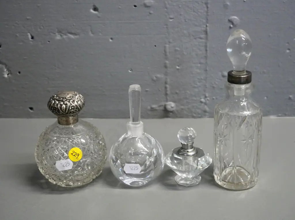 4 vintage crystal / depression glass scent bottles, one sterling silver mounted, slight damage to silver & one stopper Image 1++