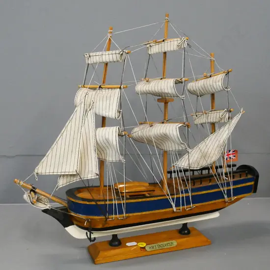 The Endeavour mixed timber model ship with fabric sails on stand - split to deck H-380 L-410