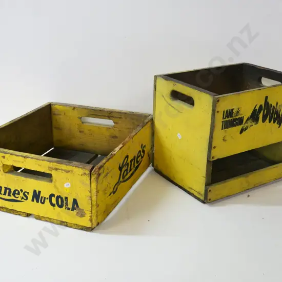 two yellow painted Lane's soda crates - Bubbly One and Nu Cola, wear to paint on both
