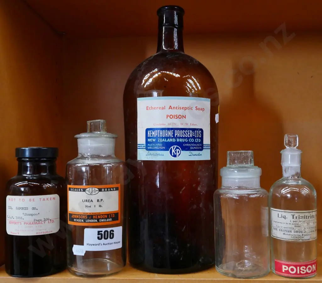 5 glass pharmacy bottles including Kempthorne Prosser NZ & Jeffery's Pharmacy Roxburgh Image 1++