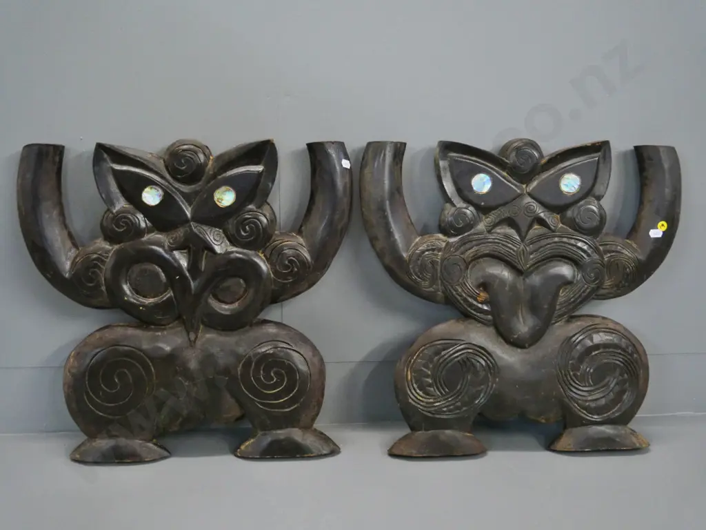 two carved wooden Maori squatting figures with paua eyes - maybe have been table supports H-430 W-460 Image 1++