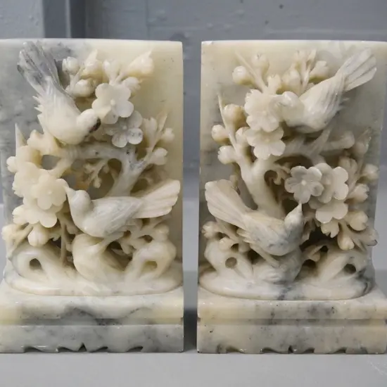 pair of Chinese carved soapstone book-ends with bird and blossom motif H-180 W-110 D-60