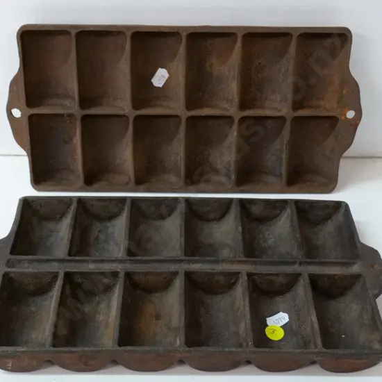 two cast iron gem irons, some corrosion, larger is 310 x 170