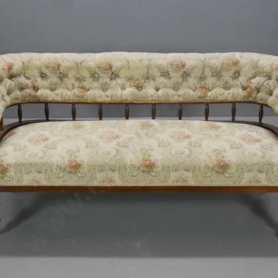 vintage spindle back deep-button settee with carved facings, porcelain casters, one loose - some fading H720 W1600 D560