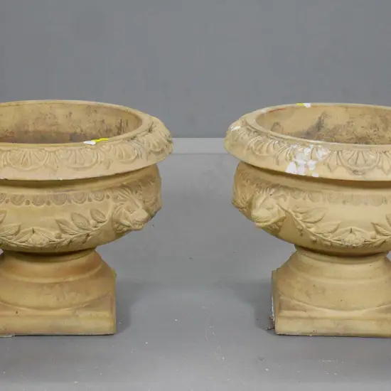 pair of reconstituted Doulton Lambeth stone classical style garden urns with lion's head motifs H-330 D-420