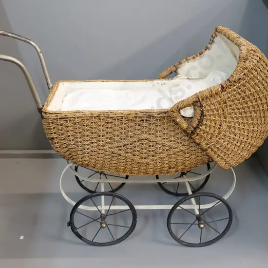 vintage seagrass doll's pram with metal wheels and frame, w/bedding - general wear, strap for hood needs attention L870