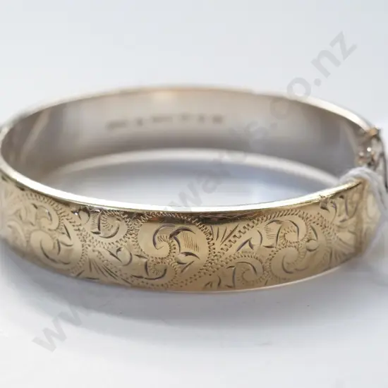 bangle with safety chain stamped 9ct sil sil