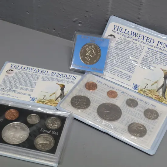 three 1988 Yellow Eyed Penguin New Zealand collector's coin items - dollar coin, uncirculated & proof sets