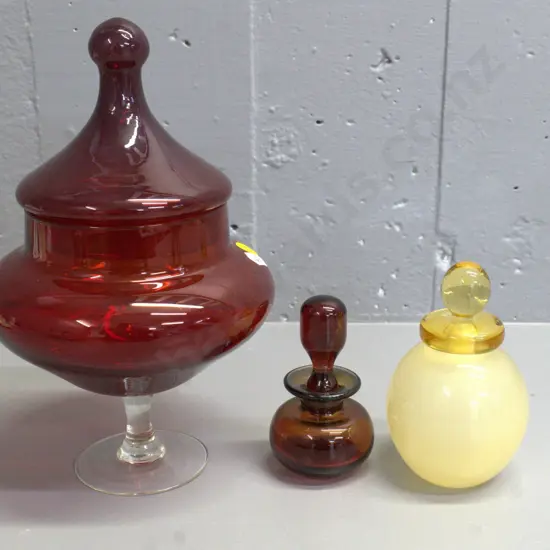 cranberry glass lidded bowl on clear stem H-260 D-150 and 2 small heavy glass stoppered bottles