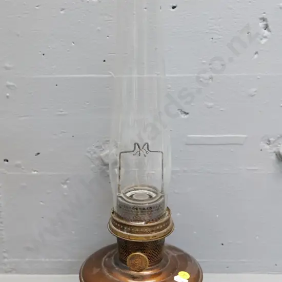 vintage Aladdin kerosene lamp with copper finish base, has chimney, no mantle H-460