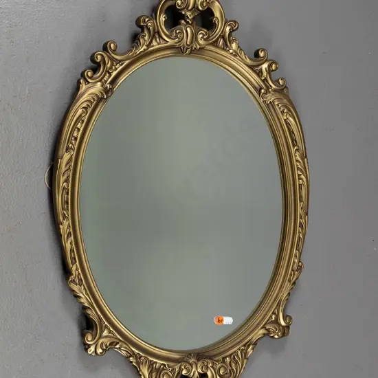 Ornate gilt framed oval wall mirror H-700 W-430
