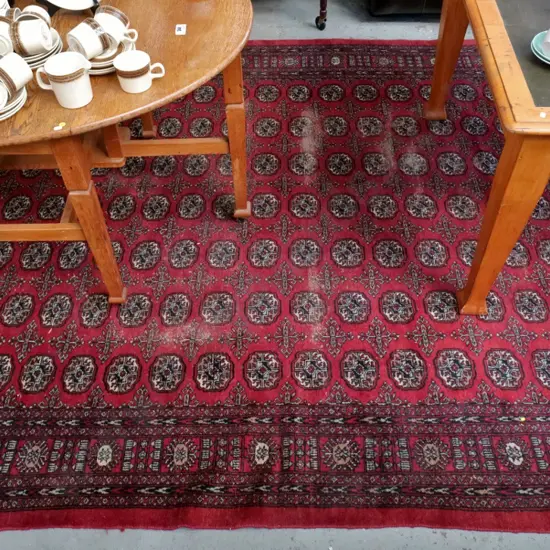 hand-knotted wool Persian style floor rug - red, browns and black - areas of significant wear L-3180 W-2170