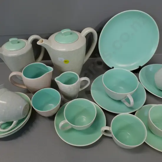 assorted Poole teaware including coffee pot, water jug, 2 creamers, plate & various tea & coffee cups & saucers