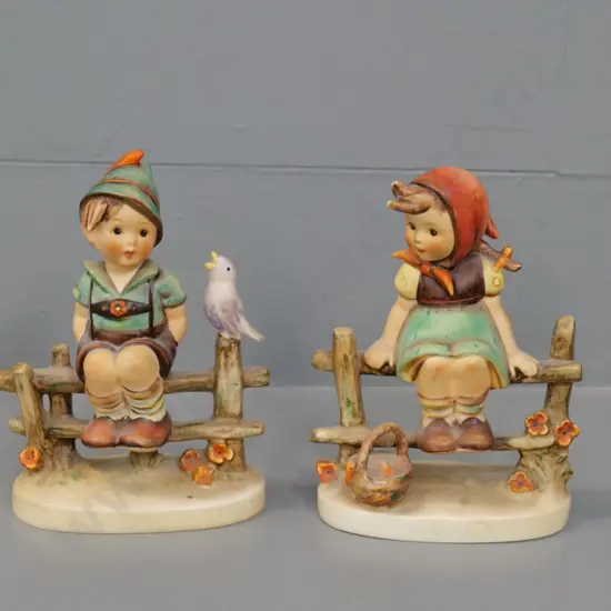 2 Goebel Hummel figurines - boy & girl sitting on fence H-130