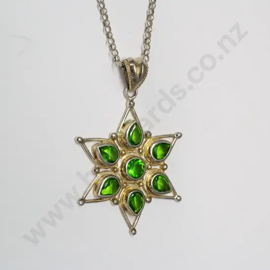 silver pendant with green stones stamped 925