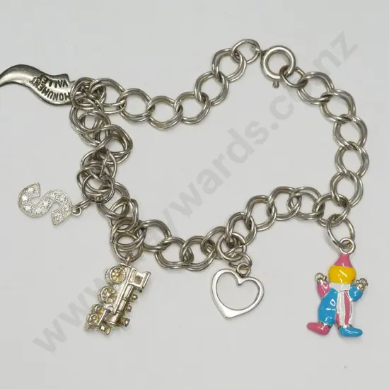 childs charm bracelet with 5 charms stamped 925