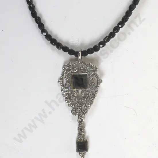 silver pendant on black beaded necklace stamped 925
